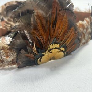 Elegant Feathered Women's Hat in Brown and Orange Hat band